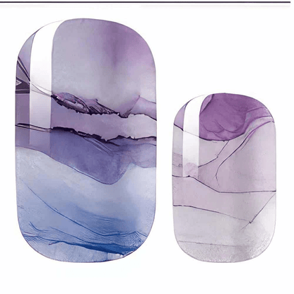 Purple and blue marbled nail wraps with a watercolour ink-swirl design and glossy finish