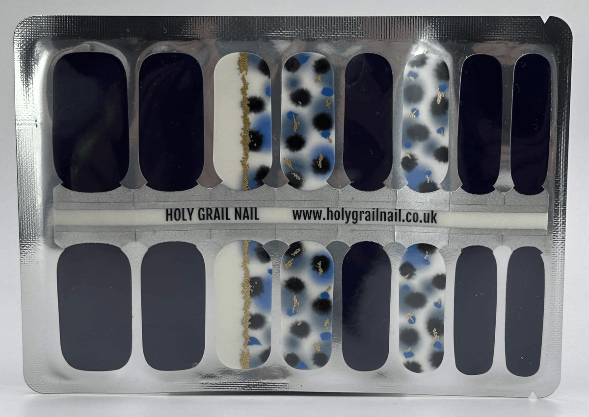 Sheer nail wraps with blue and gold terrazzo pattern in clear packaging sheet