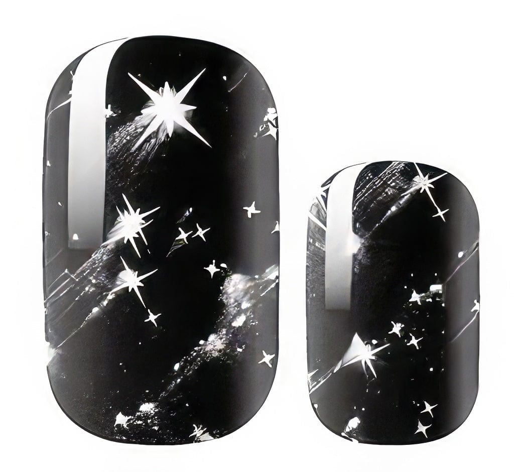 Black celestial nail wraps with silver stars and cosmic sparkle design