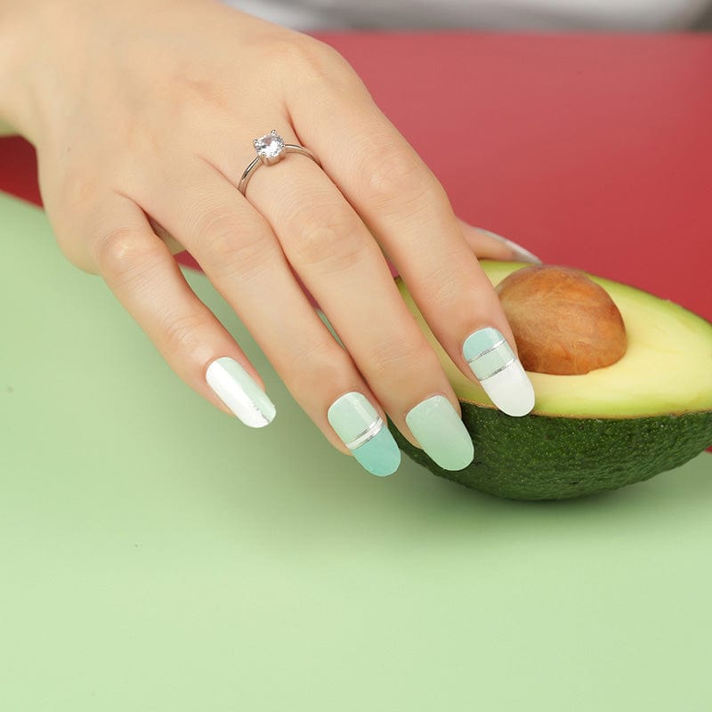 Mint green and white nail wraps with metallic silver stripe accents