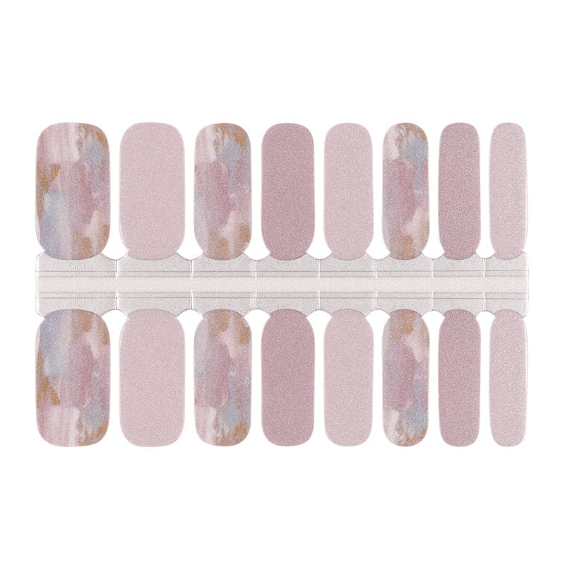 Nail wraps in dusty pink shimmer with blue-gold marble accent nails
