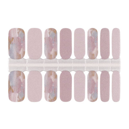 Nail wraps in dusty pink shimmer with blue-gold marble accent nails