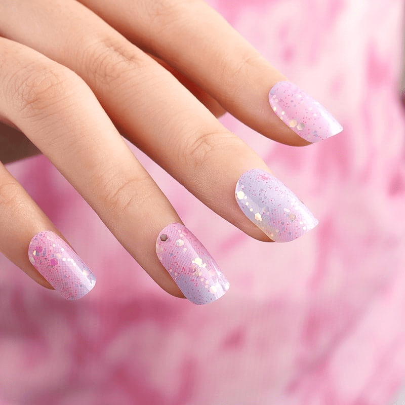 Pink and lilac ombré nail wraps with chunky iridescent glitter on square tips