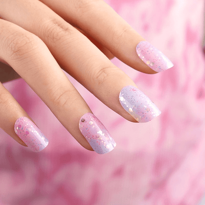 Pink and lilac ombré nail wraps with chunky iridescent glitter on square tips