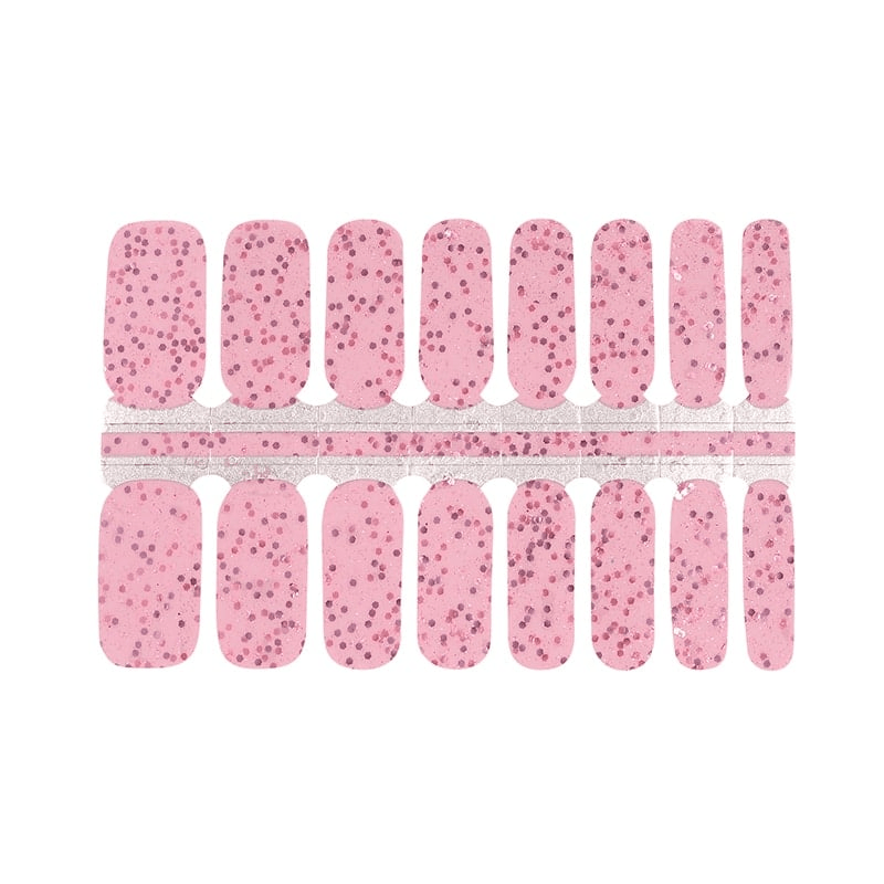 Pink nail wraps with fine glitter speckle in a sparkling confetti pattern