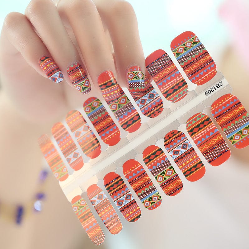 Sheet of red orange tribal geometric nail wraps with southwestern bohemian patterns for at-home manicure