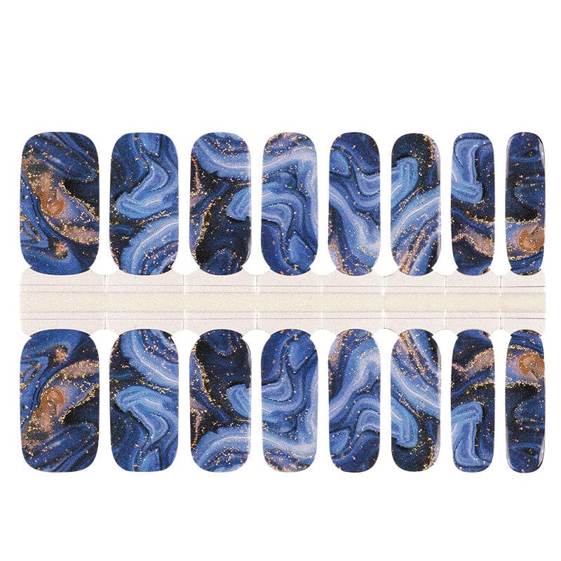 Navy blue marble nail wraps with gold foil flecks and swirling agate pattern