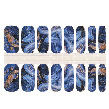 Navy blue marble nail wraps with gold foil flecks and swirling agate pattern
