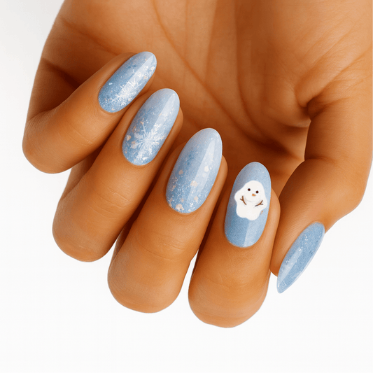 Blue glittery nail wraps with white snowflakes and cute snowman design on hand