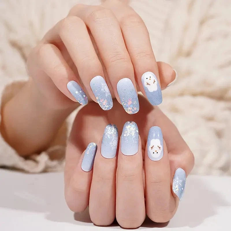 Christmas nail wraps in frosty blue with white glitter snowman nail art design
