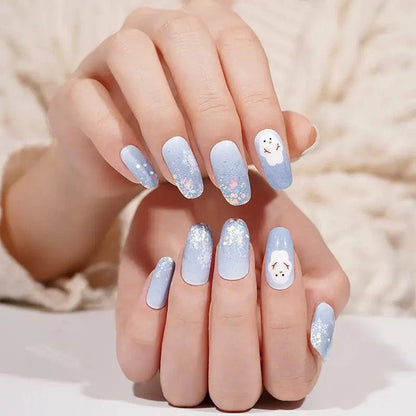 Christmas nail wraps in frosty blue with white glitter snowman nail art design