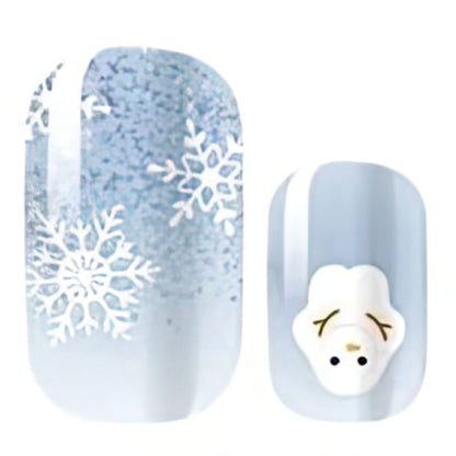 Icy blue nail wraps with white snowflake print and 3D polar bear charm accent