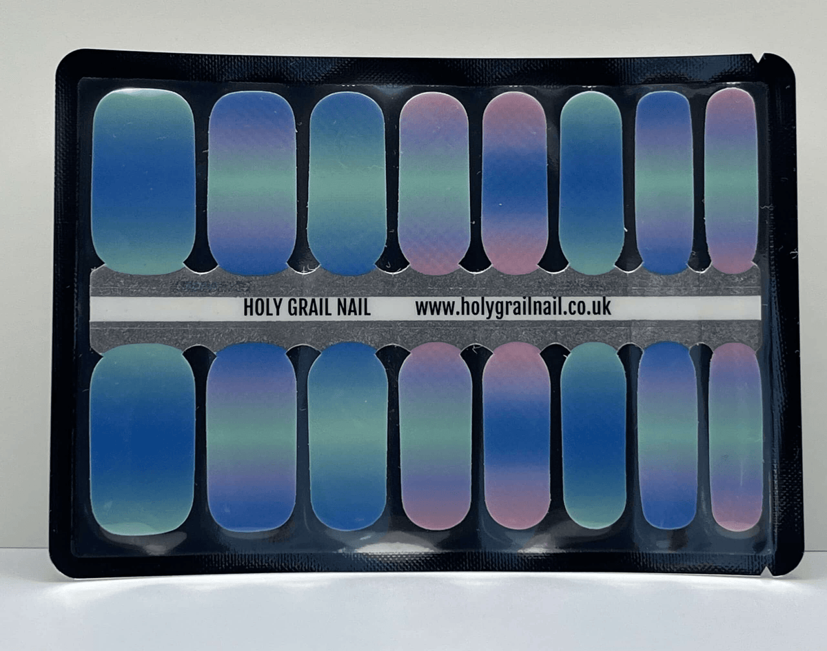 Sheet of blue to purple aurora ombre nail wraps in packaging