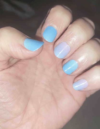 Holy Classics nail wraps in alternating blue and lilac colour-shift, glossy finish