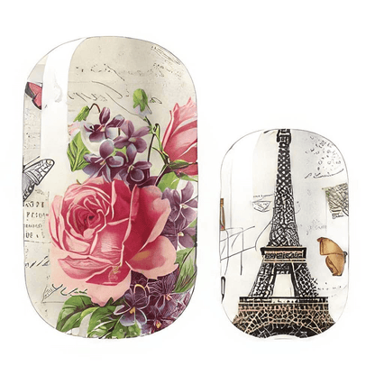 Close-up vintage Paris nail wraps with pink roses Eiffel Tower and French script details