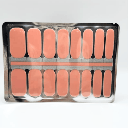 Solid peach-coral glossy Holy Classics non-UV nail wraps, shown on foil backing sheet.