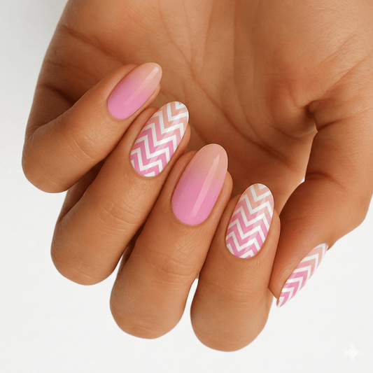 Pink and white chevron pattern nail wraps on hand showing geometric nail art design