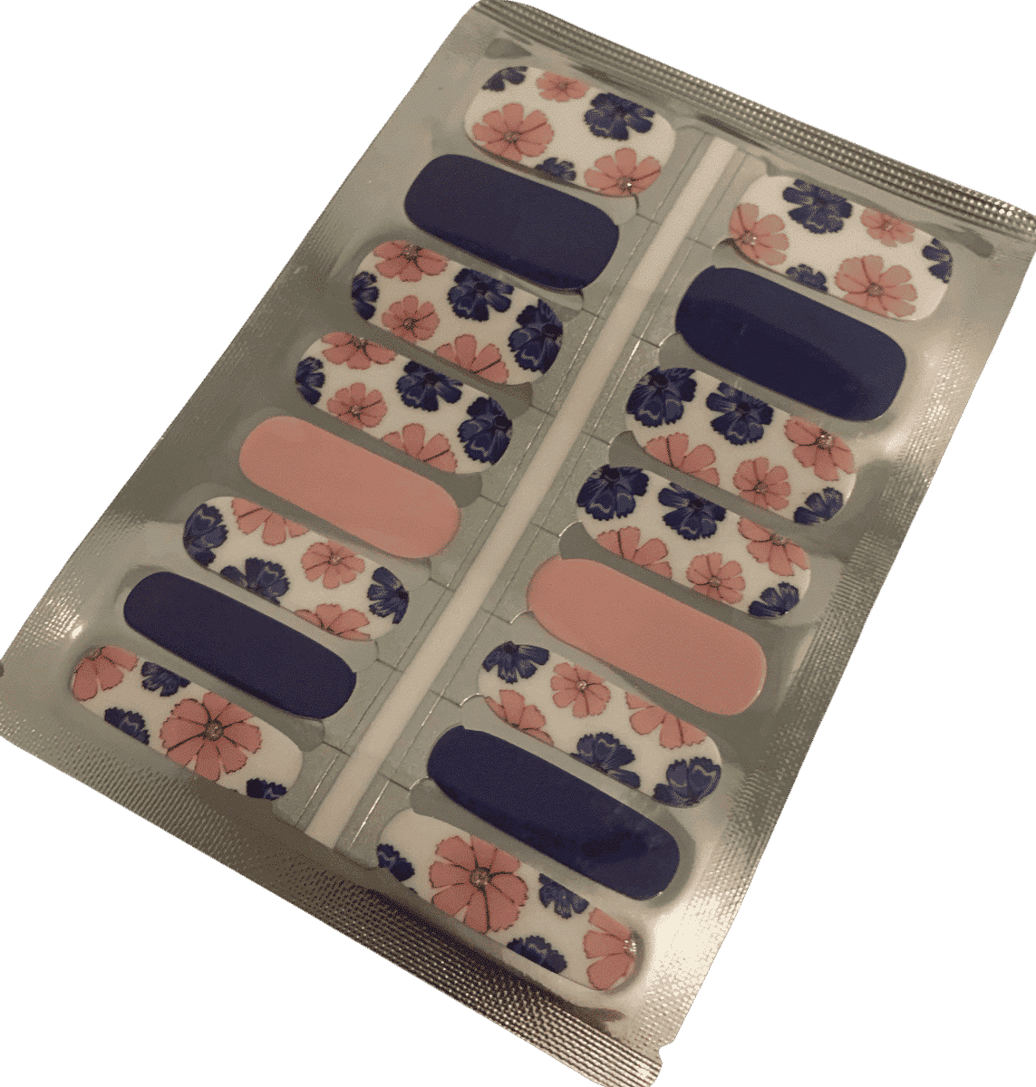 Non-UV nail wraps sheet featuring pink peony and navy floral patterns for at-home manicure