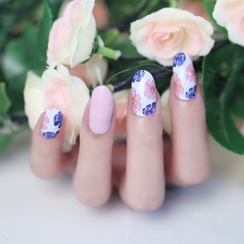 Pink and blue peony nail art wraps on fingertips with romantic floral garden design