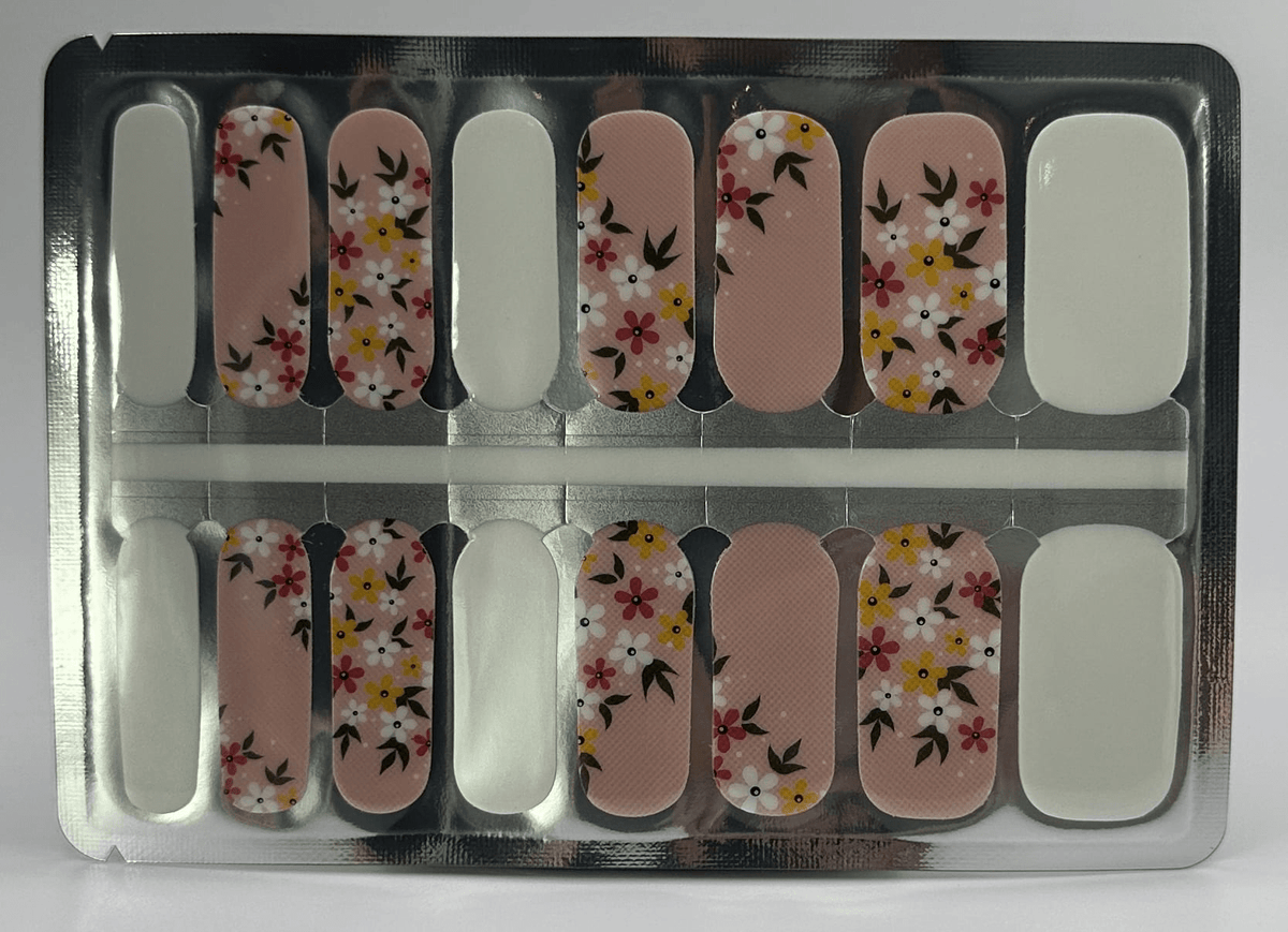 Non-UV nail wraps sheet showing pink floral pattern with yellow flowers for DIY manicure