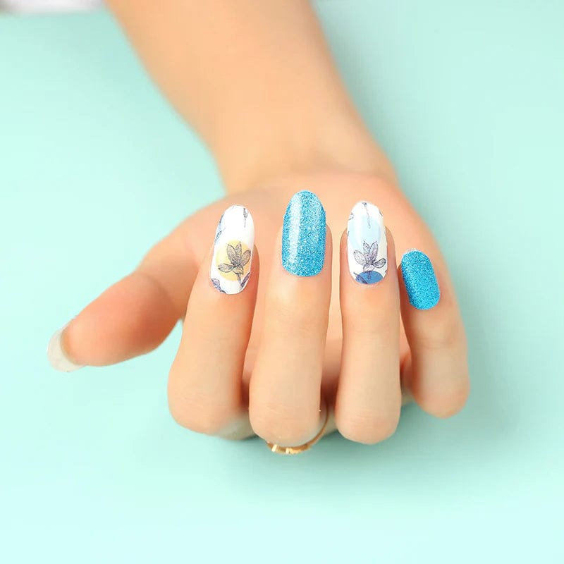 Holy Classics nail wraps, white floral print alternating with blue glitter finish