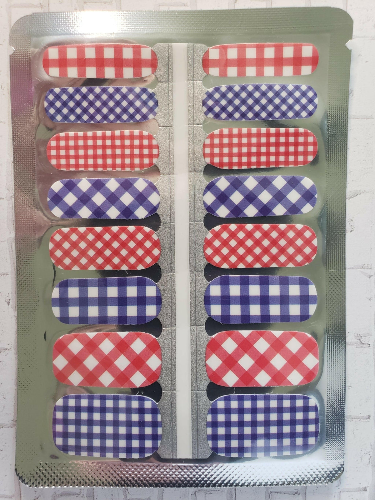 Gingham nail wraps sheet showing pink and purple checkered patterns for DIY manicures