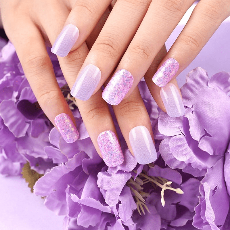 Lilac and lavender nail wraps with glossy finish and pink glitter accent nails