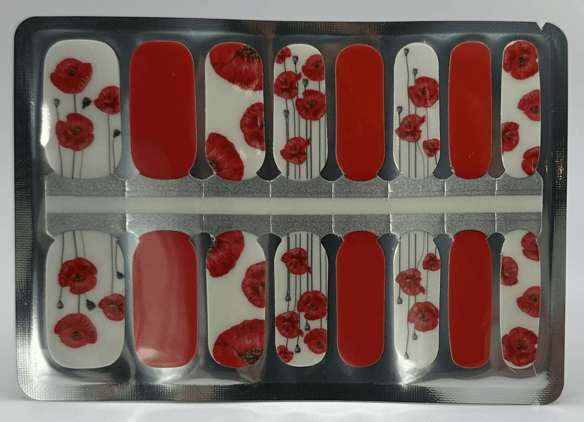 Red poppy floral nail wraps with white background in classic manicure design