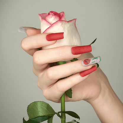 Matte red nail wraps, square tips, with black speckled and floral poppy accent nail