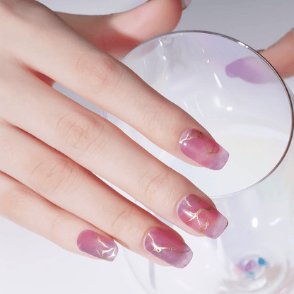 Pink marble nail wraps with gold foil crackle veining, glossy finish, square shape
