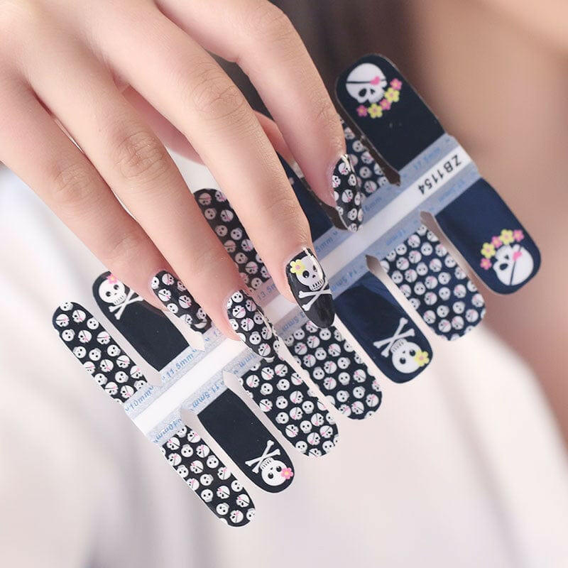 Black and white skull patterned nail wraps sheet for edgy Halloween manicure