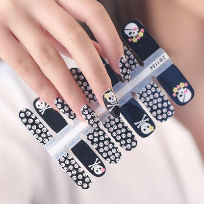 Black and white skull patterned nail wraps sheet for edgy Halloween manicure
