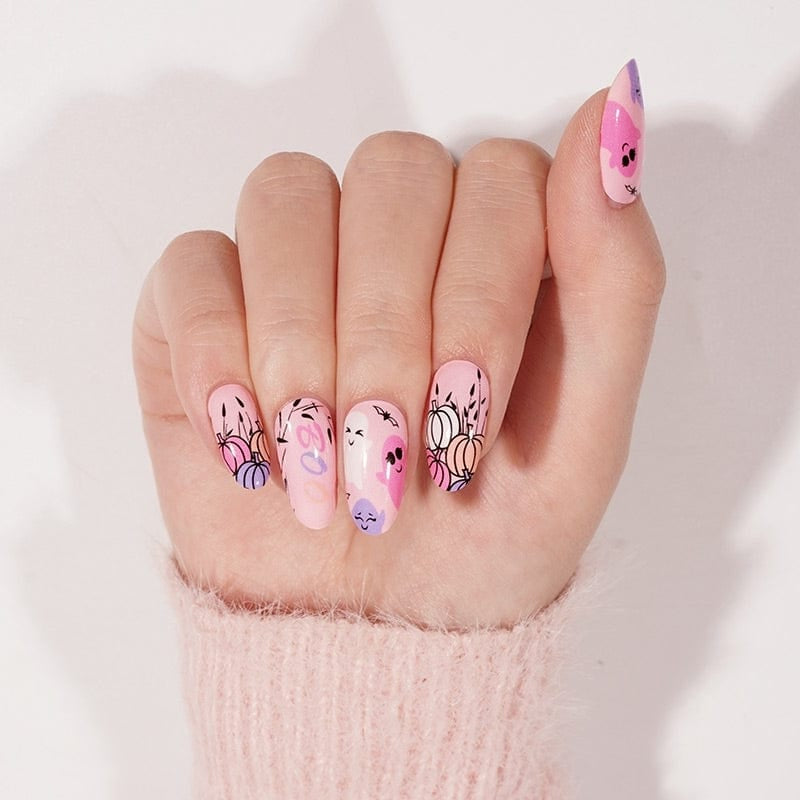 Pink nail wraps with cute ghost faces and pastel pumpkin outlines, glossy finish