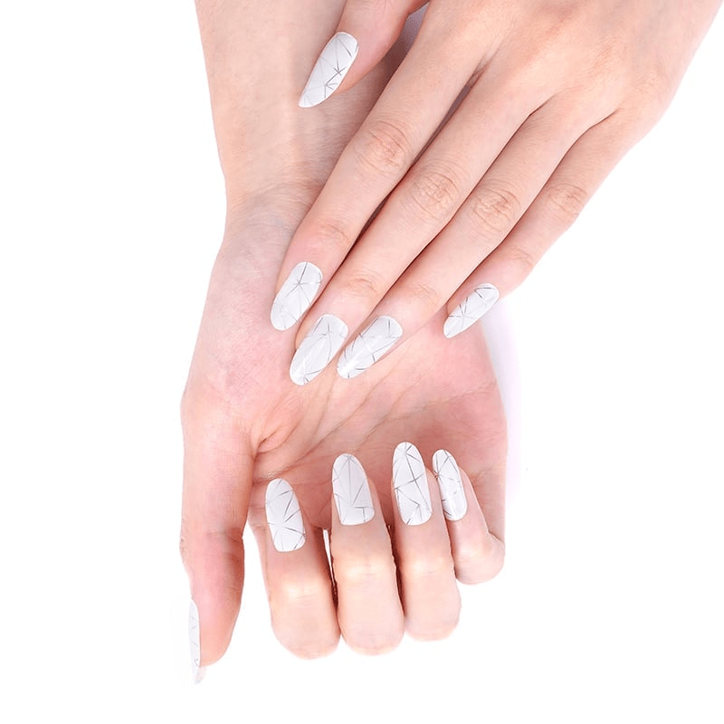Silver chrome nail wraps with geometric patterns displayed on both hands