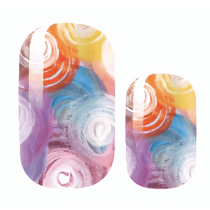Two rainbow punk nail wraps with circular glitter pattern in multicolour holographic design