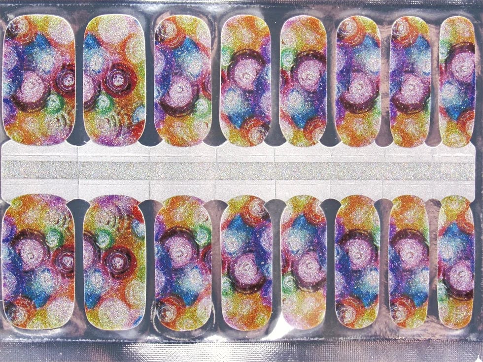 Sheet of rainbow punk non-UV nail wraps featuring holographic glitter circle patterns