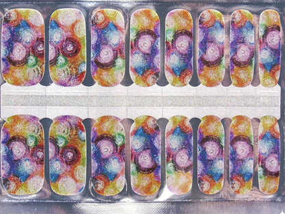 Sheet of rainbow punk non-UV nail wraps featuring holographic glitter circle patterns