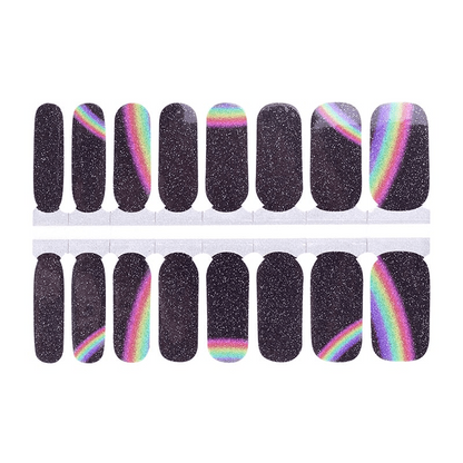 Sheet of rainbow holographic nail wraps with black glitter and cosmic design