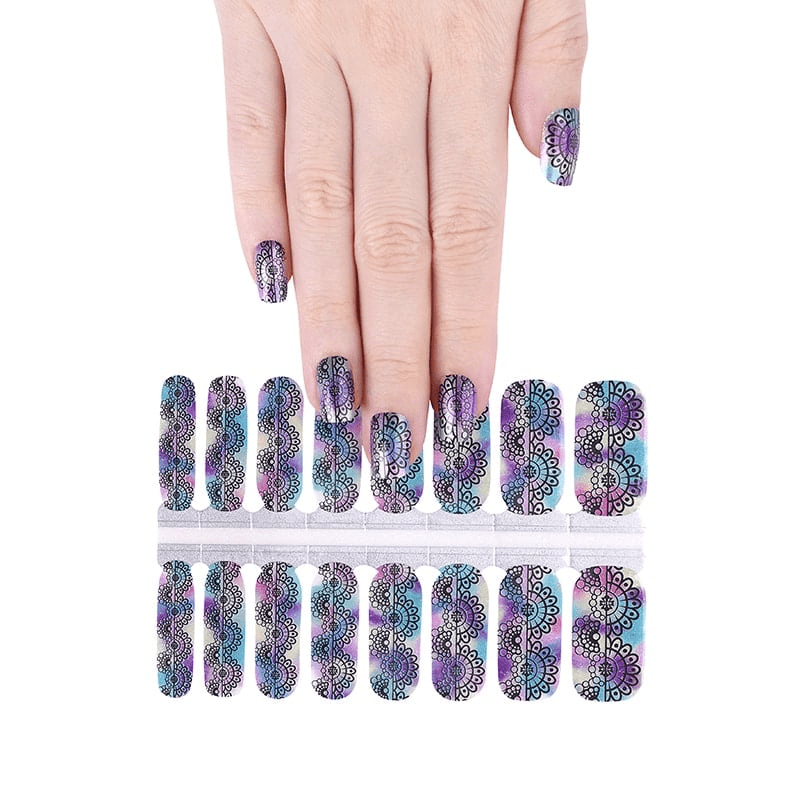 Hand displaying rainbow holographic ombre nail wraps with intricate lace pattern design