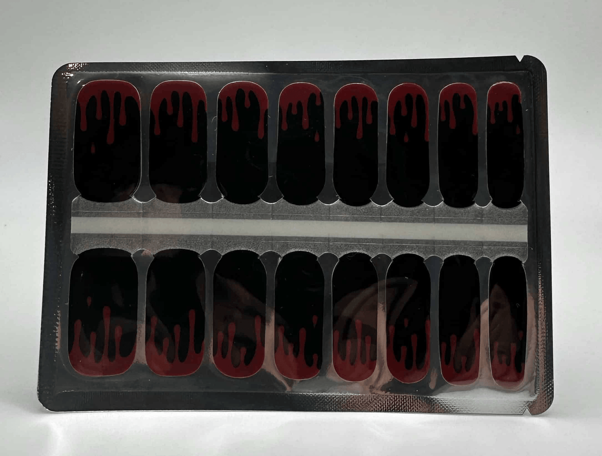 Sheet of black red flame nail wraps showing all sizes gothic design