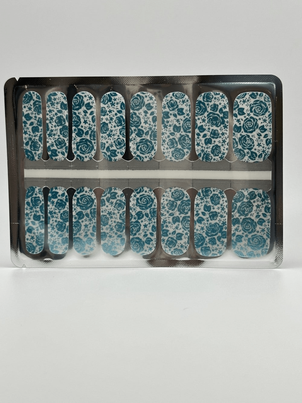 Non-UV nail wraps sheet with teal blue metallic rose floral patterns for at-home manicure