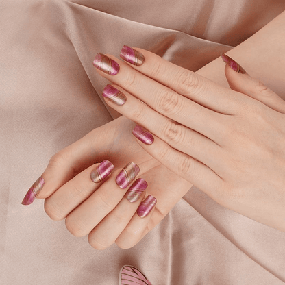 Hands wearing pink marble nail wraps showing gradient watercolour nail art