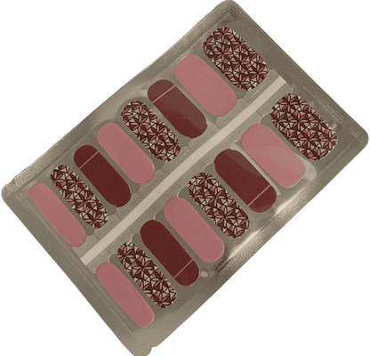 Complete nail wraps set with red pink shades and geometric floral patterns for DIY manicure