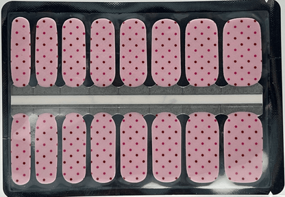 Pink polka dot nail wraps with burgundy spots in classic manicure strip format