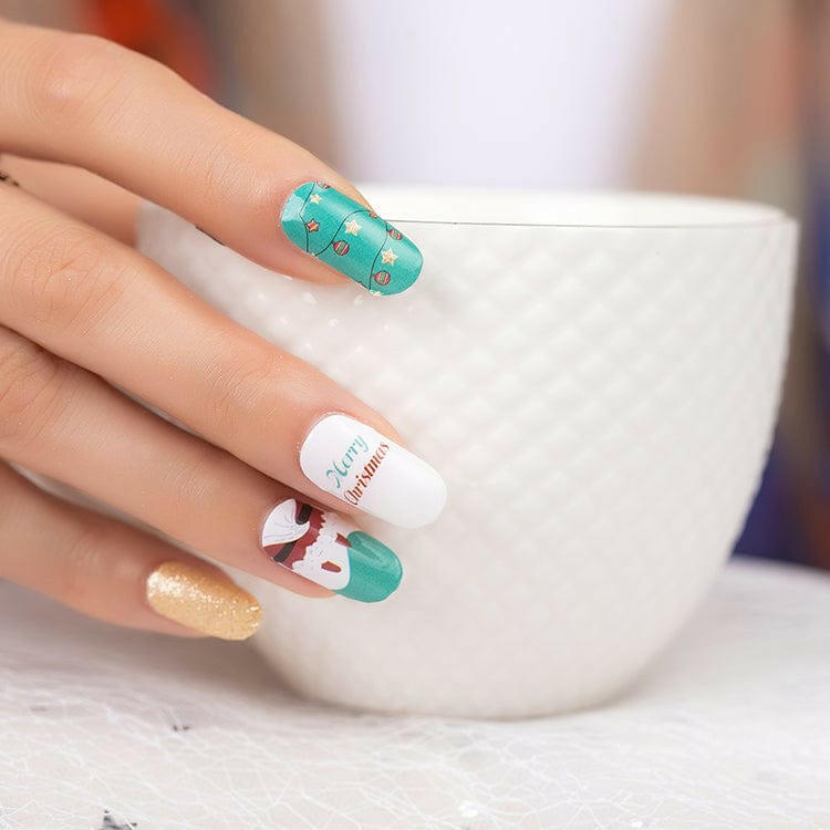 Close-up of Christmas nail wraps featuring Santa face and turquoise holiday nail art