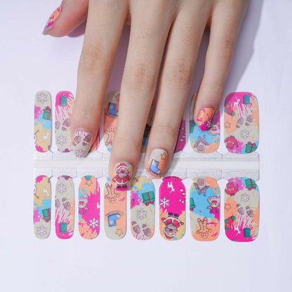 Christmas nail wrap sheet and applied manicure showing festive Santa cartoon designs in multicolours