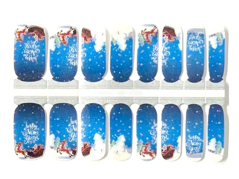 Blue Christmas nail wraps featuring Santa's sleigh with reindeer and white snowflakes festive design
