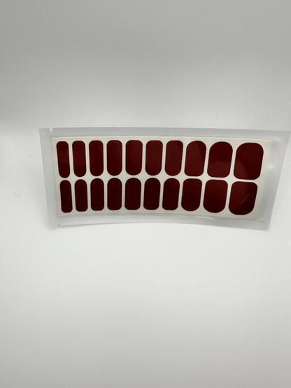 Wide fit burgundy nail wraps set showing 20 piece glossy red manicure wraps