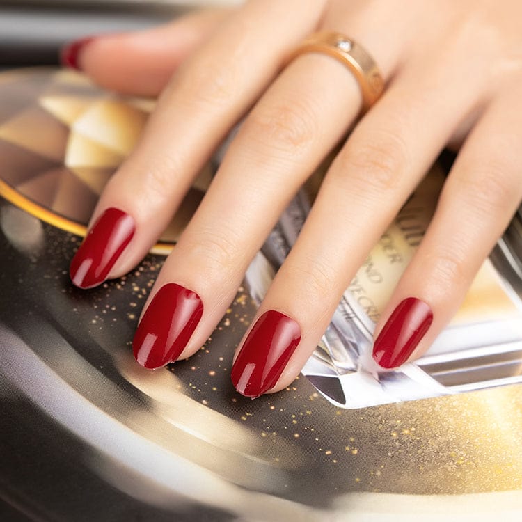 Deep wine-red nail wraps with a glossy finish, shown in a wide fit on squoval nails.