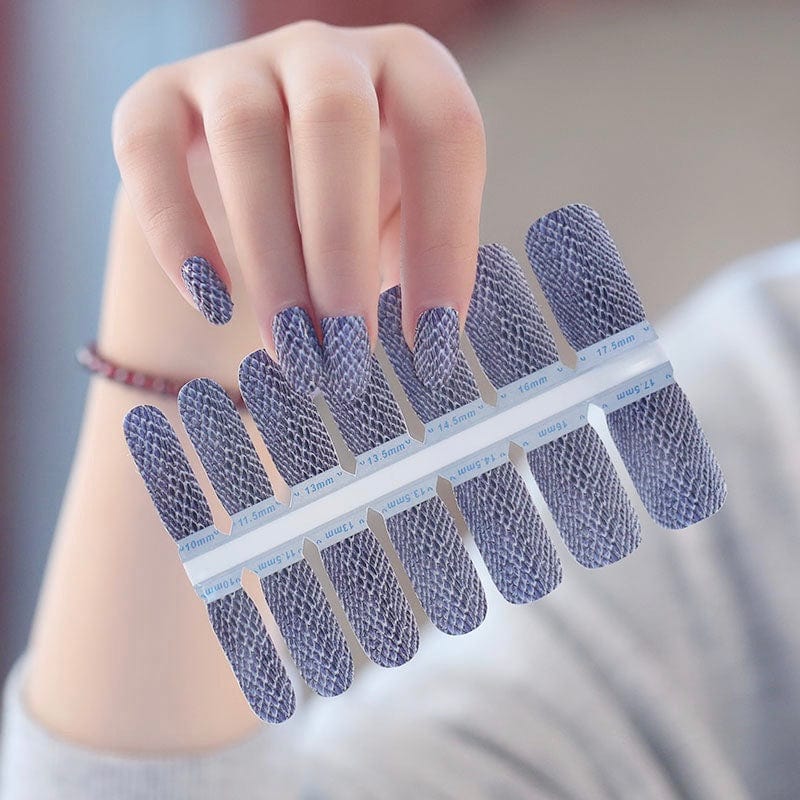 Non-UV nail wraps with grey snakeskin design displayed on sheet for at-home manicure